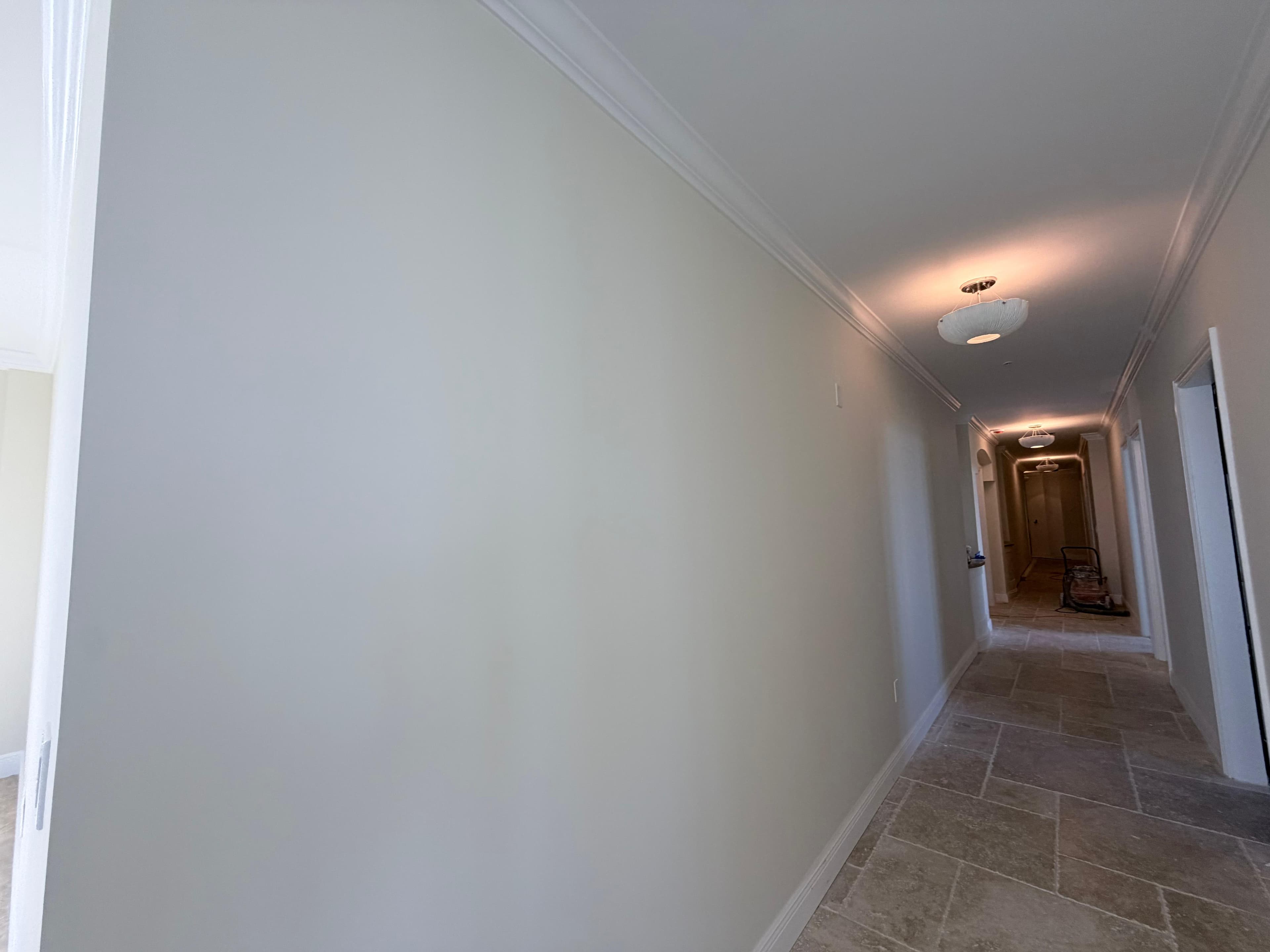 Travertine hallway flooring detail — JMF Remodeling