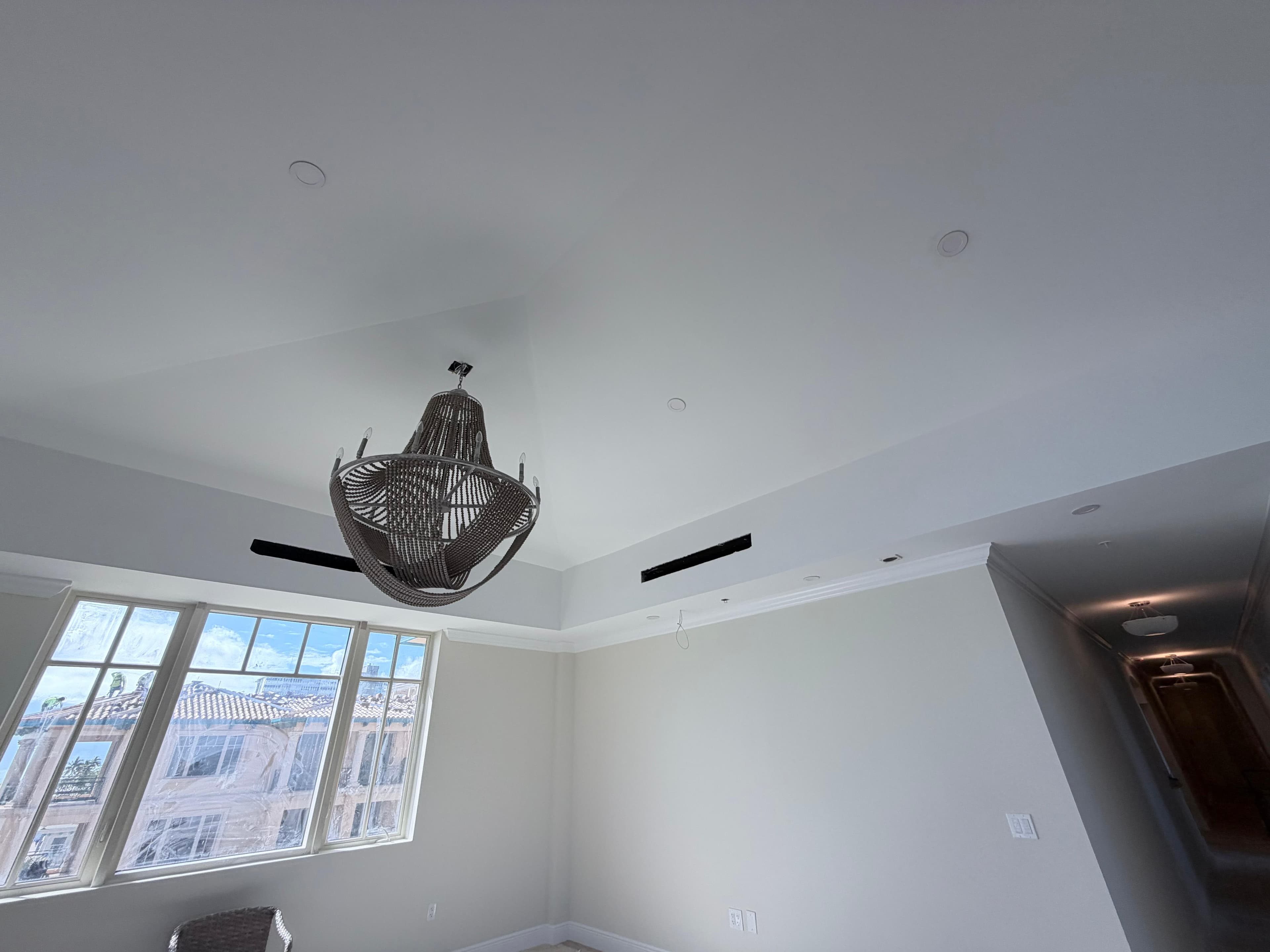 Living room with tray ceiling and ocean view